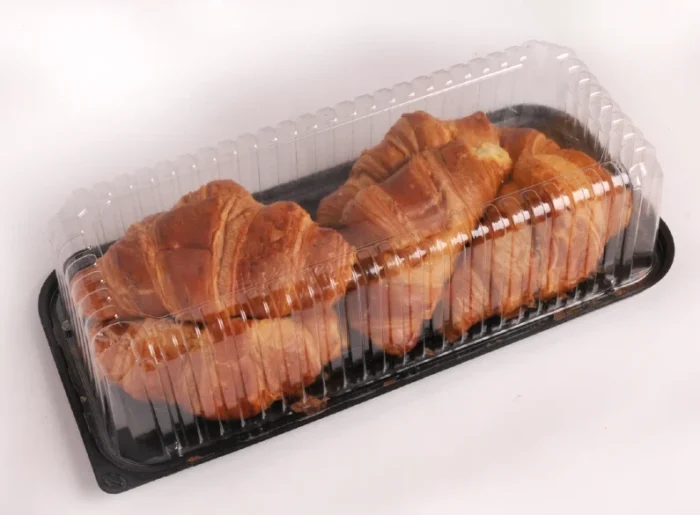 "Golden-brown croissants arranged neatly in JC Packaging's transparent croissant display tray, highlighting the product’s freshness and flaky texture."