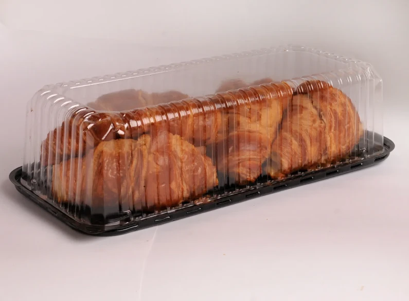 "Golden-brown croissants arranged neatly in JC Packaging's transparent croissant display tray, highlighting the product’s freshness and flaky texture."