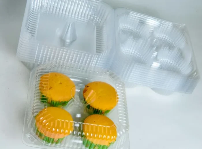 "Open and filled quad muffin packaging from www.jcpackaging.net, with a focus on the ease of access and product visibility."