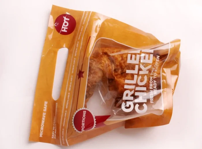 Convenient grab-and-go grilled chicken packaging with a 'HOT' label, showcasing easy microwave-safe meals from www.jcpackaging.net.