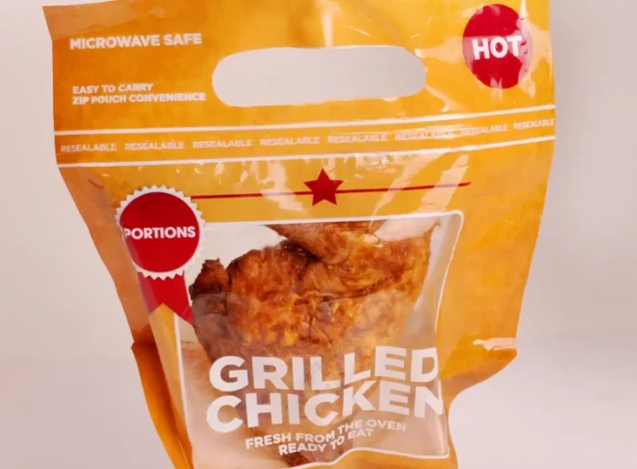 Tempting grilled chicken portion in a resealable and microwave-safe package marked 'HOT' from www.jcpackaging.net.