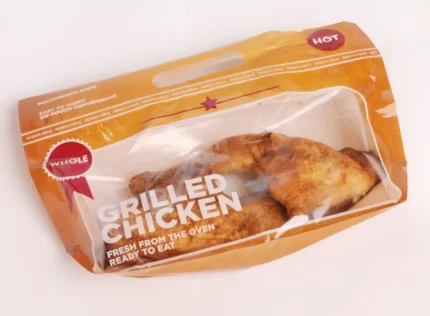 "Resealable Grilled Chicken Pouch by JC Packaging showcasing a whole, freshly oven-grilled chicken, microwave safe and ready to eat."