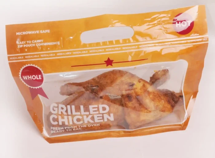 "Convenient and microwave-safe Resealable Grilled Chicken Pouch by JC Packaging, featuring a succulent, whole grilled chicken inside."