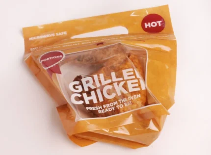 "JC Packaging's 'HOT' labeled Resealable Grilled Chicken Pouch, ensuring microwave-safe convenience and fresh, oven-ready quality."