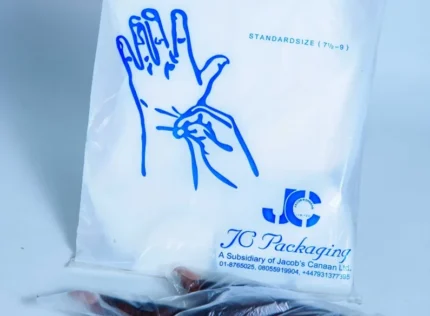 "SafeTouch Disposable Gloves in packaging with JC Packaging logo – Standard Size for Optimal Fit and Safety, available at www.jcpackaging.net."