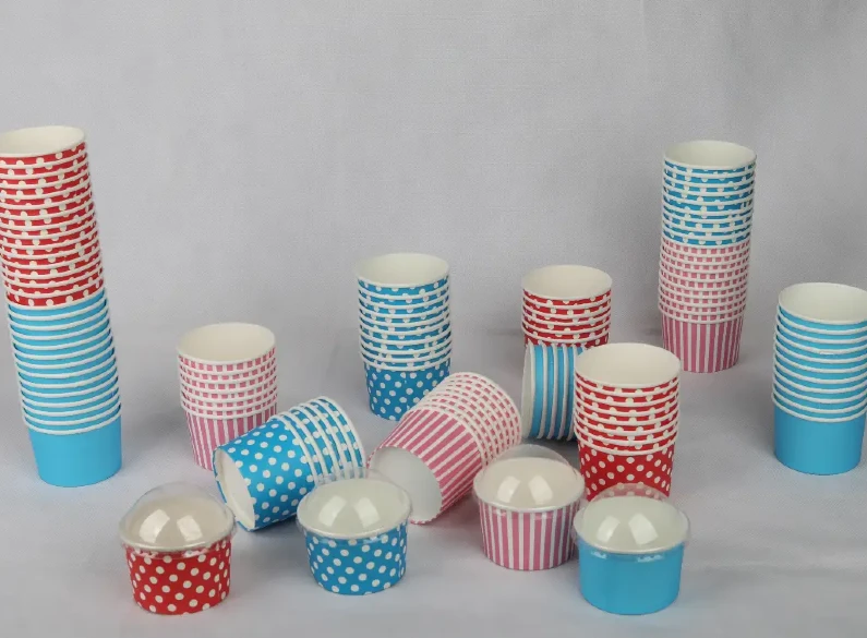 "A collection of medium-sized blue ice cream cups with white polka dots, perfect for serving sweet treats from www.jcpackaging.net."