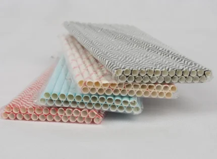 "An assortment of eco-friendly paper straws in various patterns and colors, available at www.jcpackaging.net."