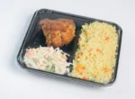 "Ready-to-Eat Meal in JC Packaging's Black Meal Prep Tray, featuring perfectly cooked chicken, rice, and salad, designed for convenience and style - More at www.jcpackaging.net"