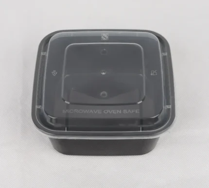 "Small square meal container by JC Packaging, featuring microwave oven safety marks, ideal for food storage and reheating."