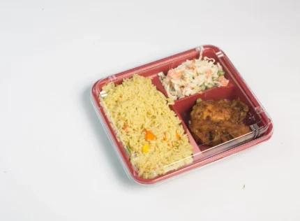 "A 3-division takeout container by JC Packaging filled with seasoned rice, coleslaw, and grilled chicken, perfect for quick and organized meals."