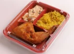 "Mouth-watering meal in a JC Packaging 3-division takeout container featuring crispy chicken, rice, and coleslaw, ideal for a convenient dining experience."