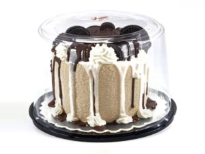 6 inch clear cake dome with black base holding a cake