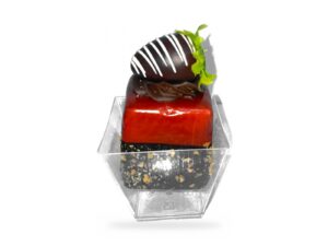 Clear square acrylic dessert cup with a mini cake